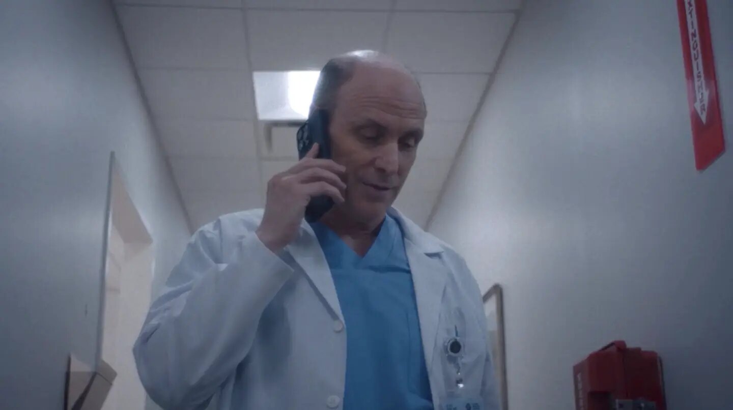 Drew Moore as Dr. Son in the hospital hallway