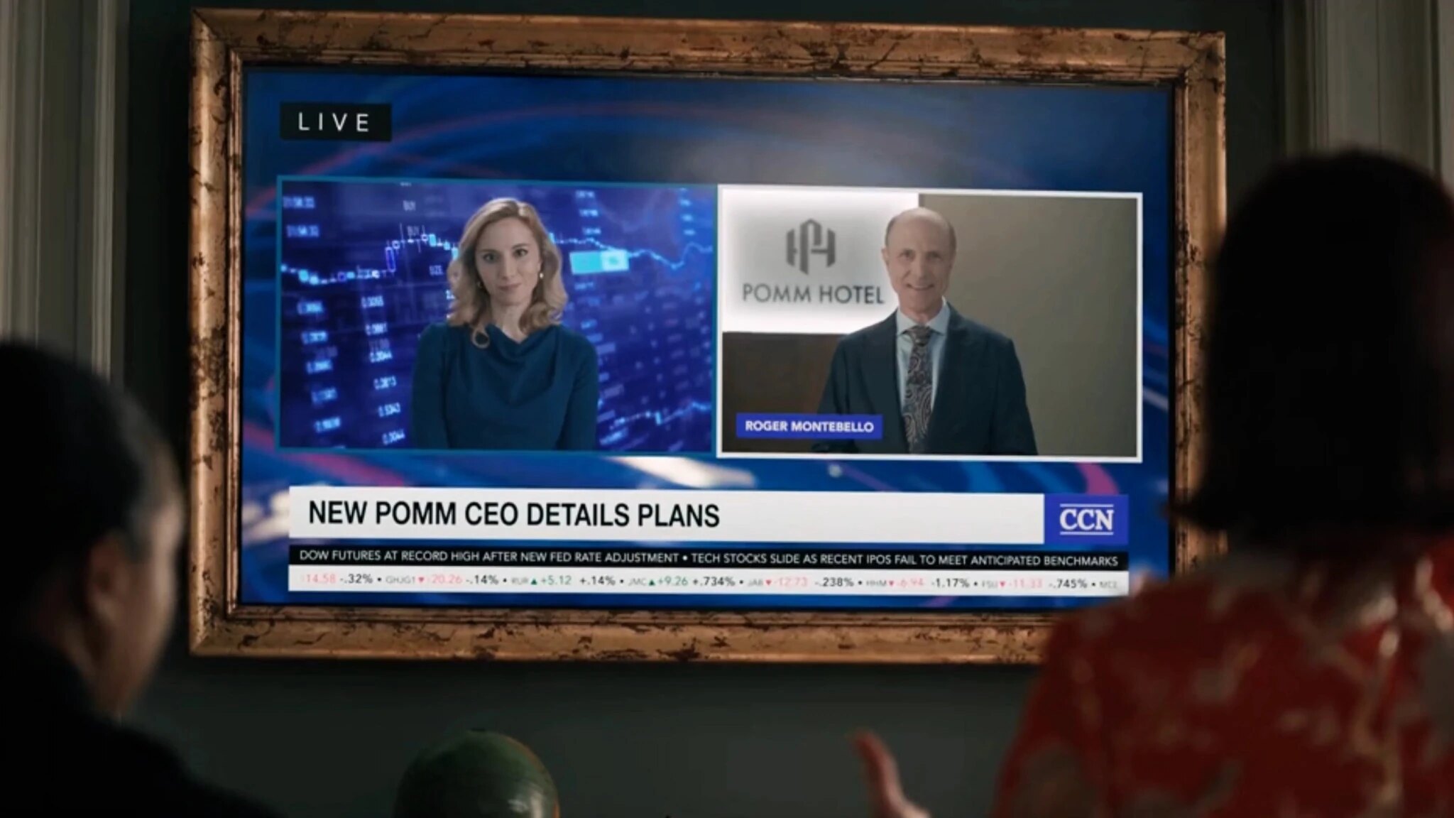 Elsbeth watches a television interview with CEO Roger Montebello
