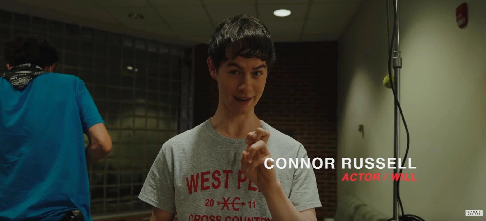Connor Russell interviewed behind the scenes in his West Penn shirt