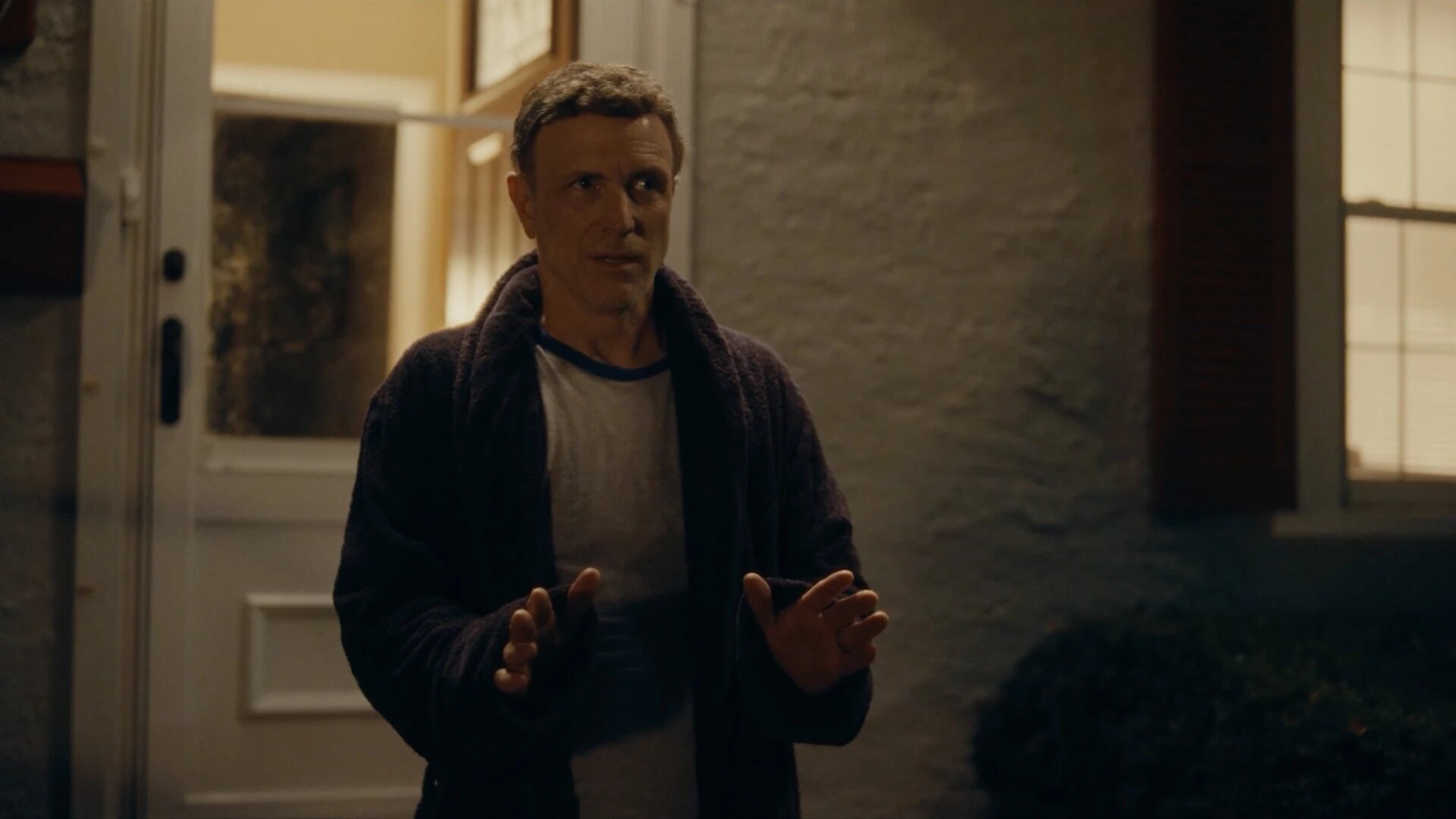 Mr. Greene holds up his hands during the nighttime confrontation