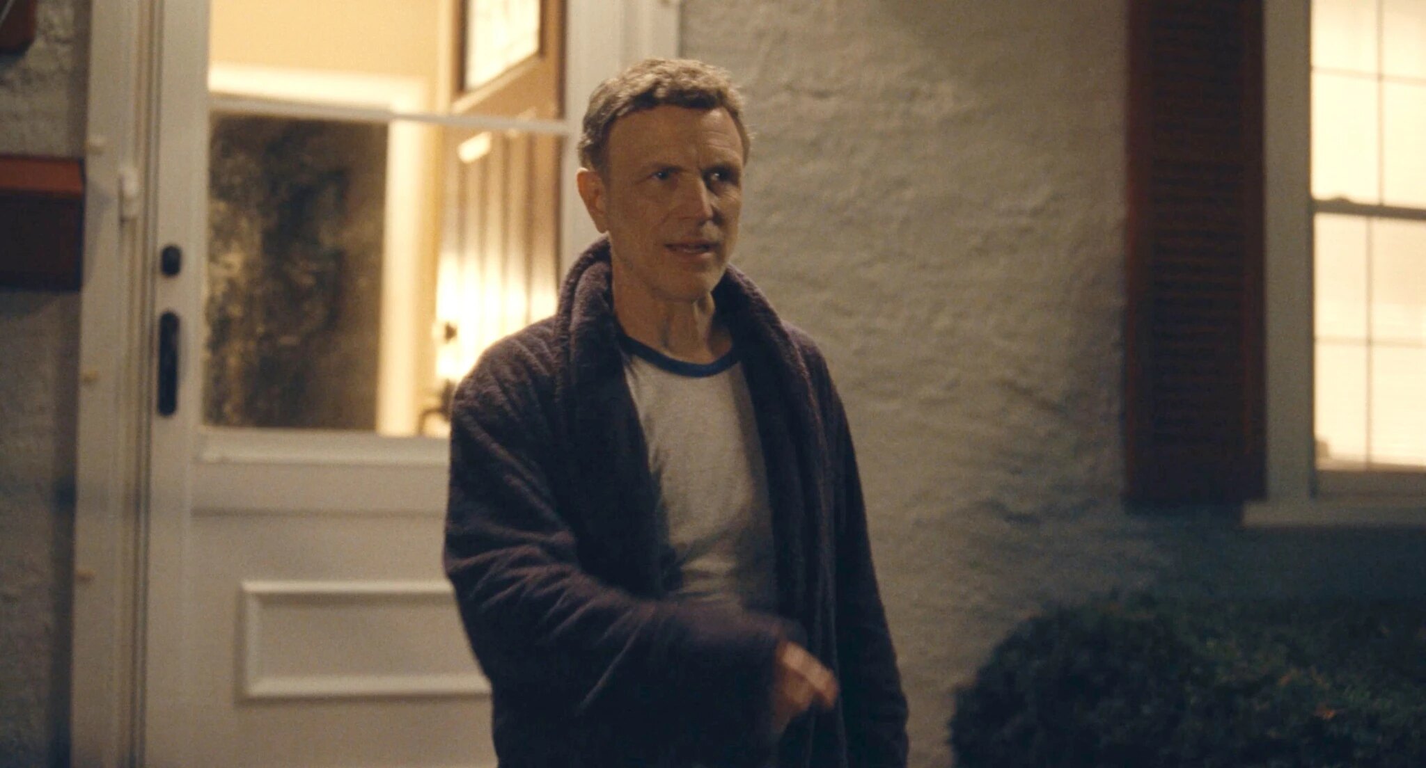 Mr. Greene on his porch at night