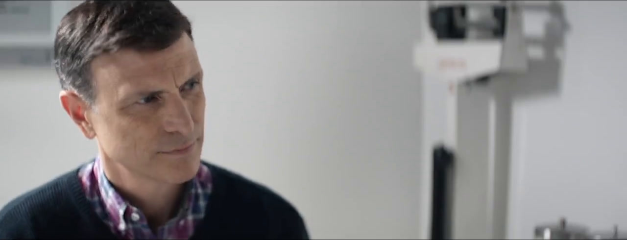 Drew Moore as Arthur, silently listening beside the hospital bed